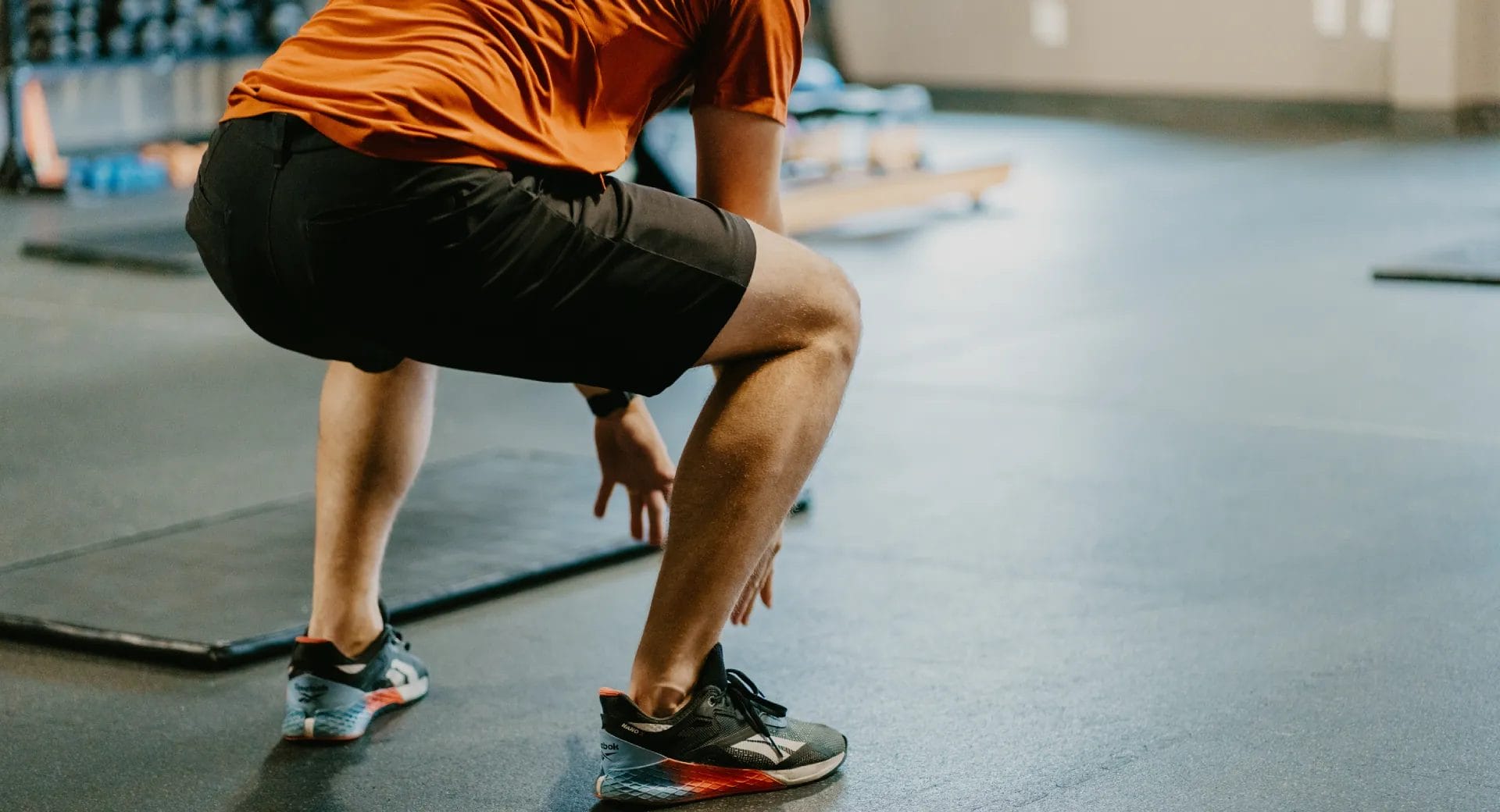 Man doing squats at the gym