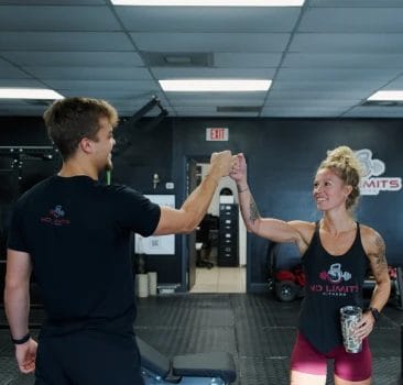 Coaches giving fist greeting